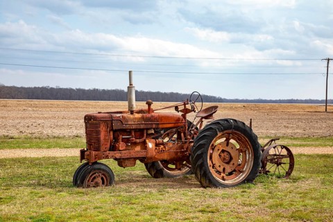 Greenwood, Mississippi - An old tractor in the Mississippi delta at the Tallahatchie Flats & Tavern