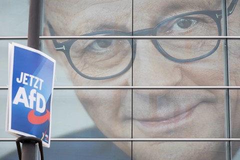 An election poster of the far-right AfD party (now AfD) hangs in front of a portrait of Friedrich