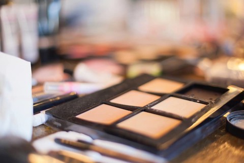 Assorted makeup products macro with shallow depth of field. Natural light