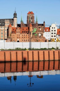 Old Town of Gdansk skyline in Poland, embankment water reflection on Old Motlawa River