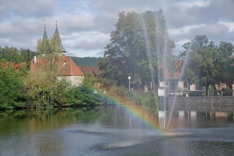 View from the Feuersee lake to the town church, rainbow, water feature, water fountain,