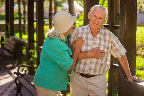 Senior man has heart ache. Elderly couple outside. I feel pains again. Husband has chronic illness