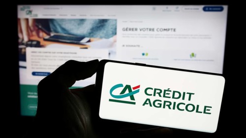 Stuttgart, Germany, 11-16-2023: Person holding smartphone with logo of French financial services