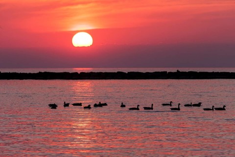 Sunset over Lake Huron as seen from the shoreline in Goderich, Ontario, Canada, North America