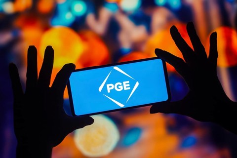 In this photo illustration, the Portland General Electric (PGE) logo is displayed on a smartphone