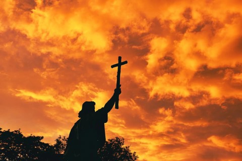 St Boniface statue at sunset, orange sky, Fulda, Germany