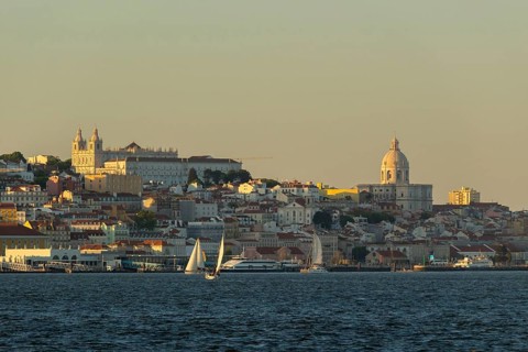 Lisbon City Center Skyline and Tagus River at Sunset. National Pantheon and Sailboats. Portugal
