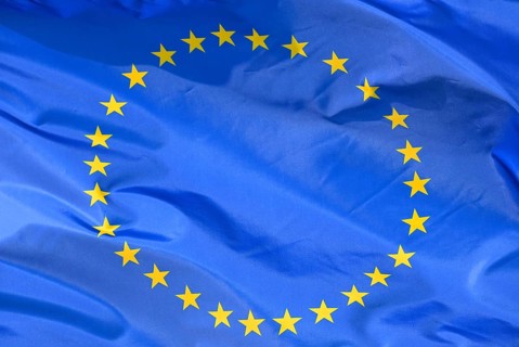 Close-up of the EU flag, flag of the European Union, with 27 stars fluttering in the wind