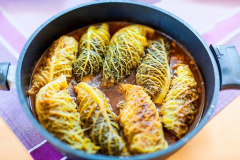 Cabbage rolls are prepared in a pan