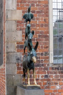 The famous bronze statue of the Bremen Town Musicians with the figures of a donkey, dog, cat and