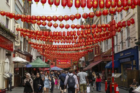Red Chinese lanterns crossing above Gerrard Street, Chinatown, West End, London, England, UK