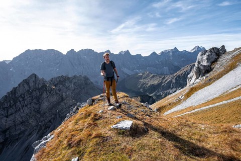 Mountain panorama with picturesque mountain landscape, mountaineers descending from the Gamsjoch,