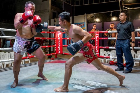 Thai boxing Muai Thai boxer in action, Pattaya, Thailand