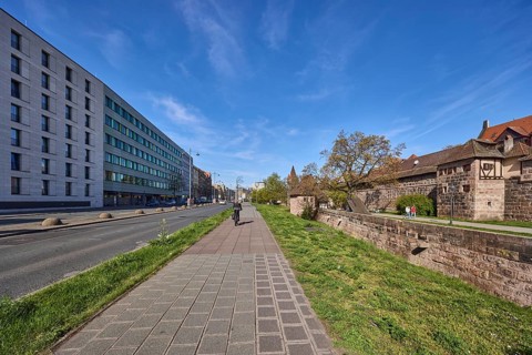 Footpath and cycle path, trees, meadow, city fortification, city wall, pedestrians and cyclists as