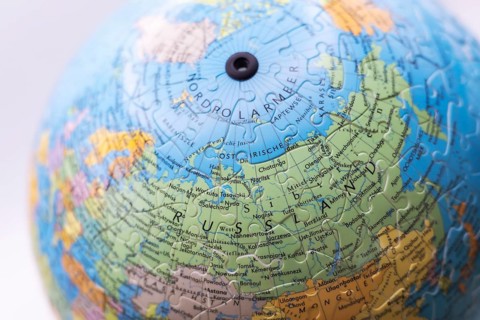 Puzzle globe. Map made from puzzle pieces. Russia and North Pole