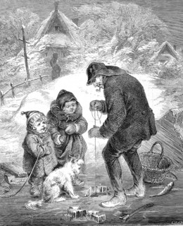Ice fishing, fisherman has cut a hole in the ice and is fishing, two children and a dog are