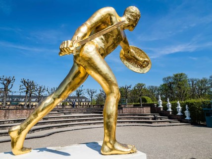 Golden sculpture, warrior with shield and sword, Herrenhausen Gardens, Baroque garden at castle