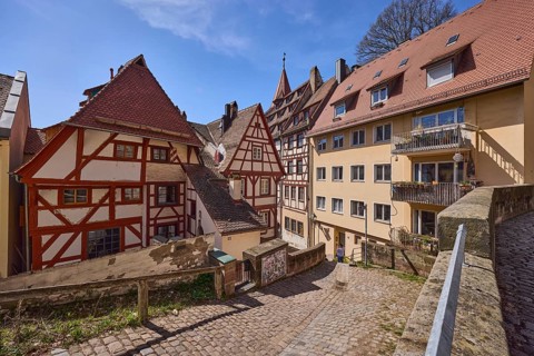 Historic half-timbered houses, residential buildings, gables, pointed roofs, sandstone wall, metal