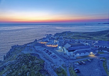 Land's End, landscape and hotel on the Atlantic, at dusk. Land's End, the tip of the headland in