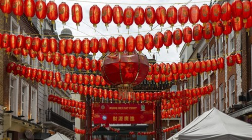 Red Chinese lanterns crossing above Gerrard Street, Chinatown, West End, London, England, UK