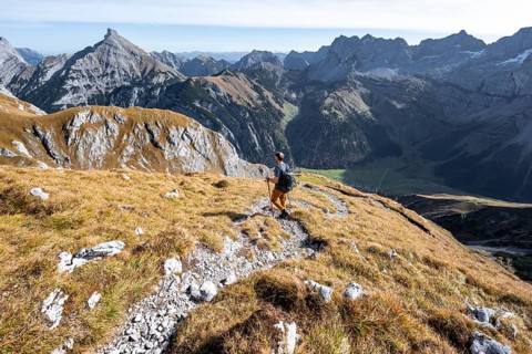 Mountain panorama with picturesque mountain landscape, mountaineers descending from the Gamsjoch,