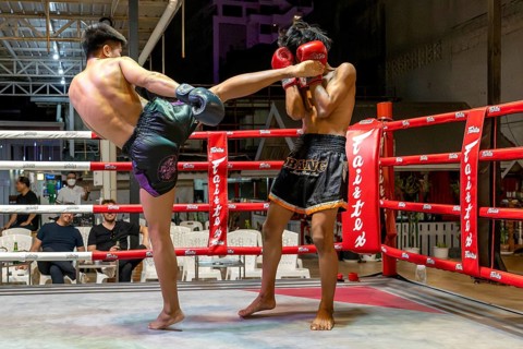 Thai boxing Muai Thai boxer in action, Pattaya, Thailand
