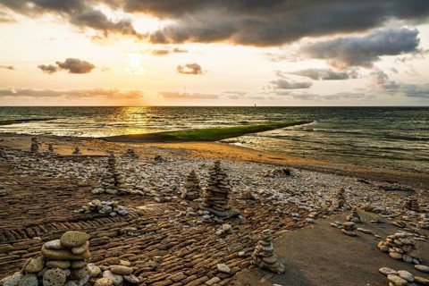 Sunset over beach of WHALE LIGHTHOUSE, Saint-Clement-des-Baleines, Atlantic, France