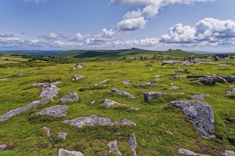 Stones and landscape at the top Tor tor rock hill in Dartmoor National Park. Widecombe-in-the-Moor,