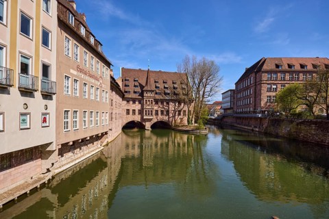 Heilig-Geist-Spital, historical building, river Pegnitz, facade, windows, trees, symmetrical