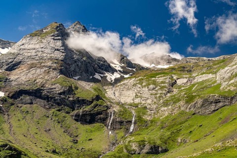 Waterfall at the Cirque de Troumouse basin in the Pyrenees National Park near Gavarnie-Gèdre,