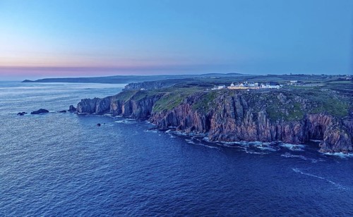 Land's End, landscape and hotel on the Atlantic, at dusk. Land's End, the tip of the headland in