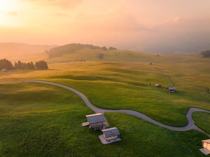Hilly landscape at dusk in a harmonious atmosphere, Alpe di Siusi, Dolomites, South Tyrol, Italy