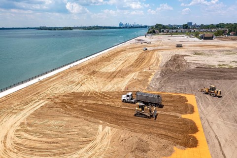Detroit, Michigan - Workers spread clean dirt after old industrial contamination of cadmium,