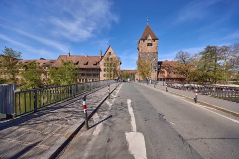 Schuldturm, historical buildings, car and pedestrian bridges, metal railings, blue sky,