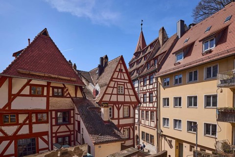 Historic half-timbered houses, residential buildings, gables, pointed roofs, facade, windows, blue