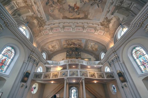 Interior with organ loft of the baroque parish church of St Nicholas, 1725, Tannheim, Austria