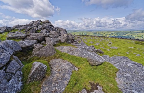 Stones and landscape at the top Tor tor rock hill in Dartmoor National Park. Widecombe-in-the-Moor,