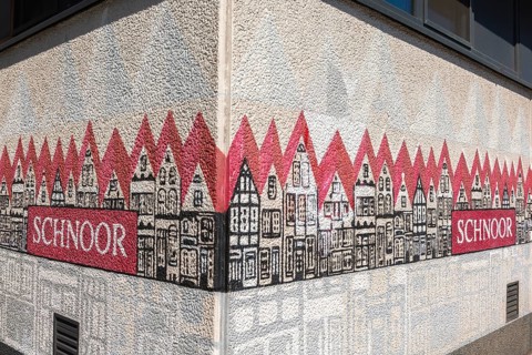 Painting on house wall with name, renovated Schnoor neighbourhood with small shops, galleries,