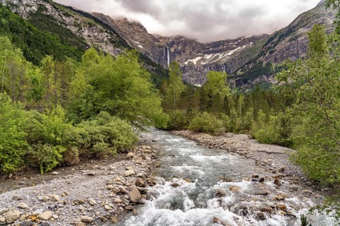 The Gave de Gavarnie river in the Cirque de Gavarnie basin, UNESCO World Heritage Site in the