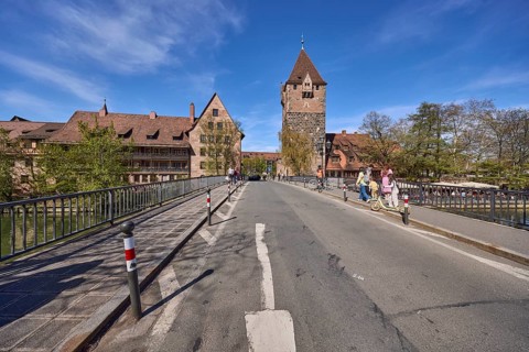 Schuldturm, historical buildings, car and pedestrian bridges, metal railings, pedestrians as