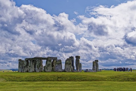 A group of tourists visits Stonehenge. The stone circle, a National Trust, UNESCO World Heritage