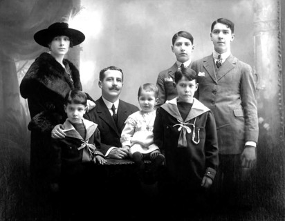 Family with 5 children, portrait of a family in traditional dress, formal group photo, historical