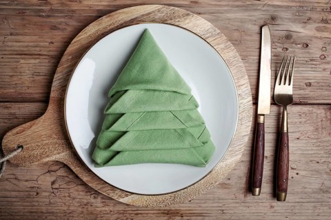 Plates with cutlery and festive decoration
