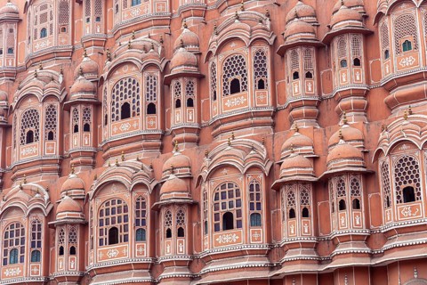 Jaipur, India, December 11, 2019: Beautiful windows of the Hawa Mahal, Palace of Winds in the pink