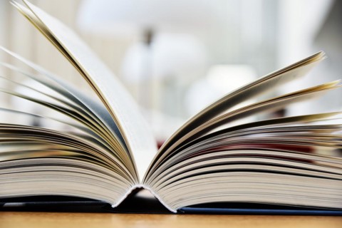 Hardcover book lying on the table in a library