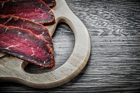 Sliced steak wooden chopping board food concept