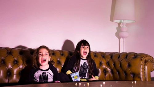 Scared kids watching movie home