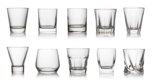 Glass of drinking whiskey isolated on a white background
