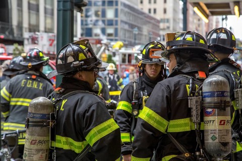 New York, United States of America, November 20, 2016: Group of firemen waiting in front of the