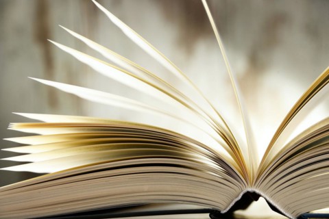 Composition with hardcover book on the table